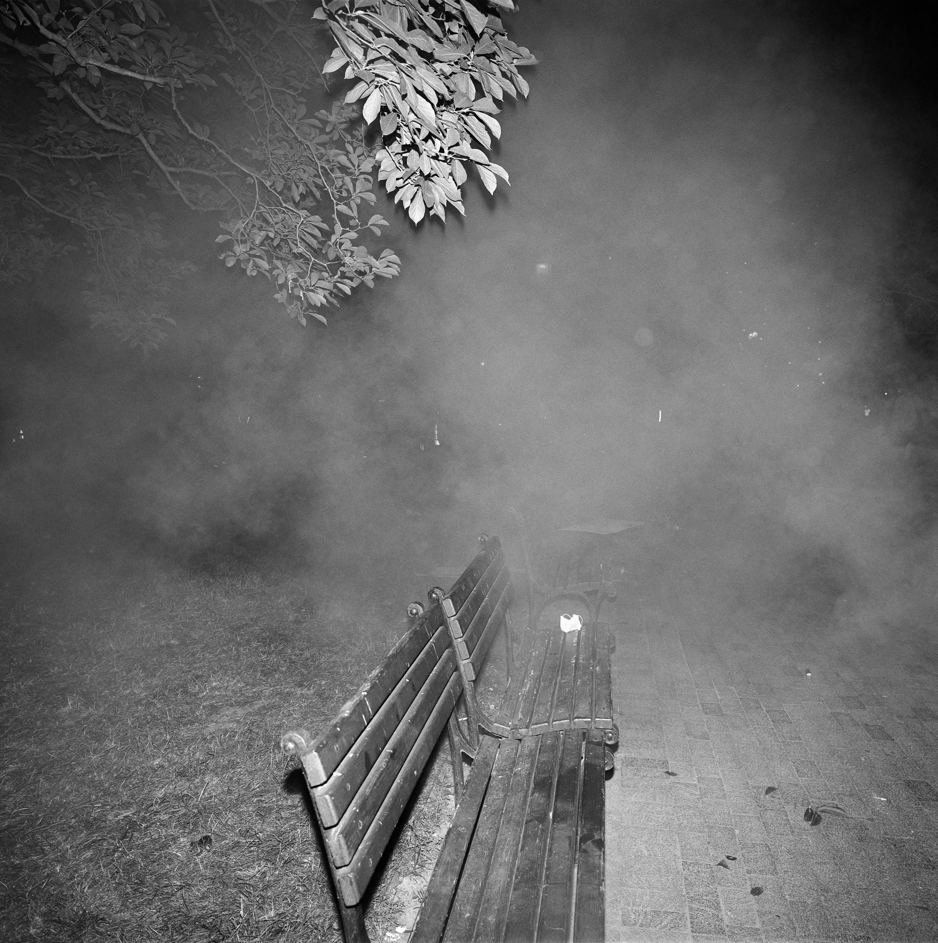 Tear gas fired by police surrounds a bench in Lafayette Park not far from the White House during the second night of protests related to the murder of George Floyd, a Black man who was killed by a police officer in Minneapolis. The security situation in Lafayette Park led to the White House bringing in several units of the National Guard including additional police and security forces from the federal government.