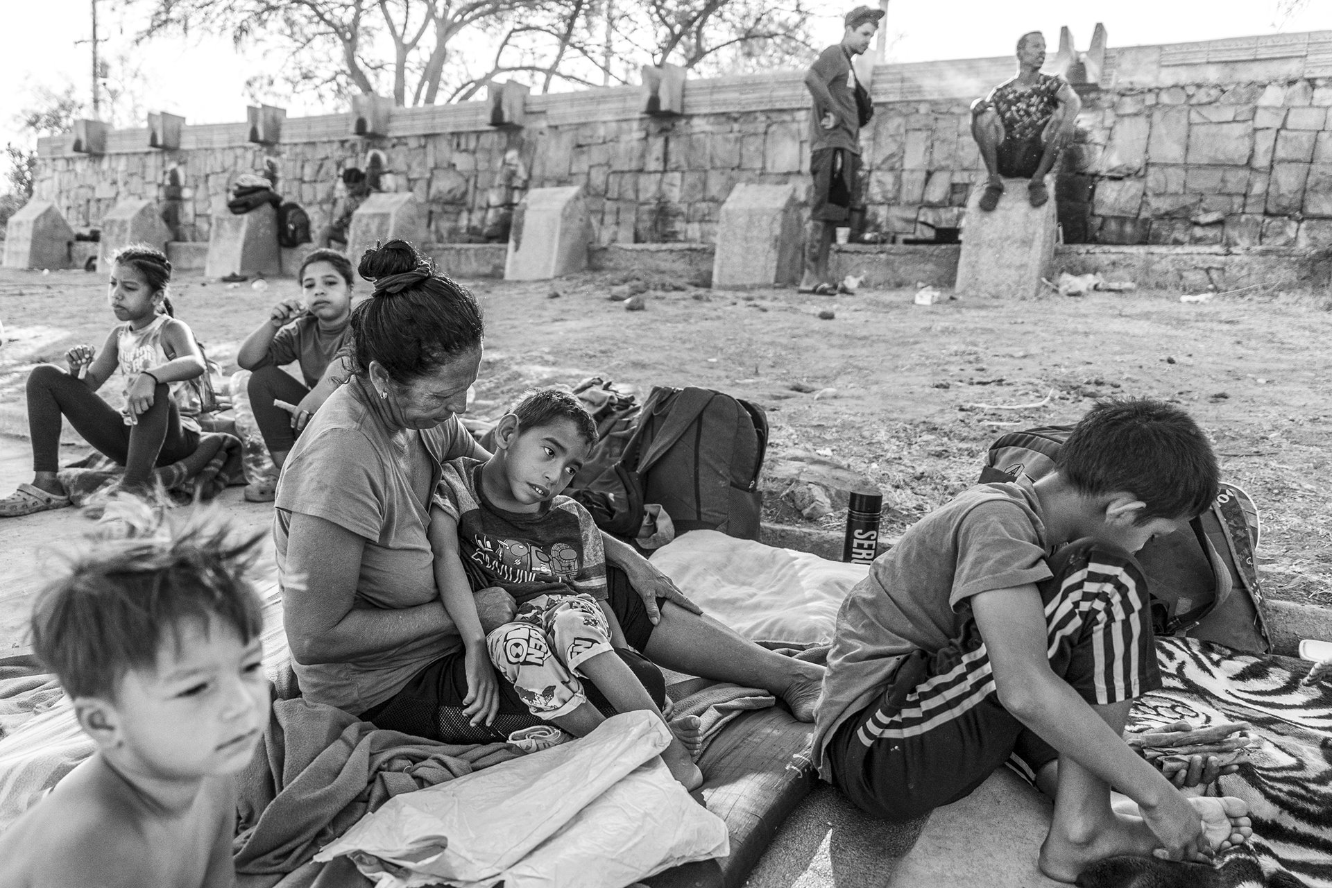 Marisol Sivira, a Venezuelan migrant, holds her son Yonkeiver Sivira in Parque Público Federal El Chamizal. Yonkeiver (5) suffers from constant convulsions caused by an undiagnosed syndrome. Ciudad Juárez, Mexico.