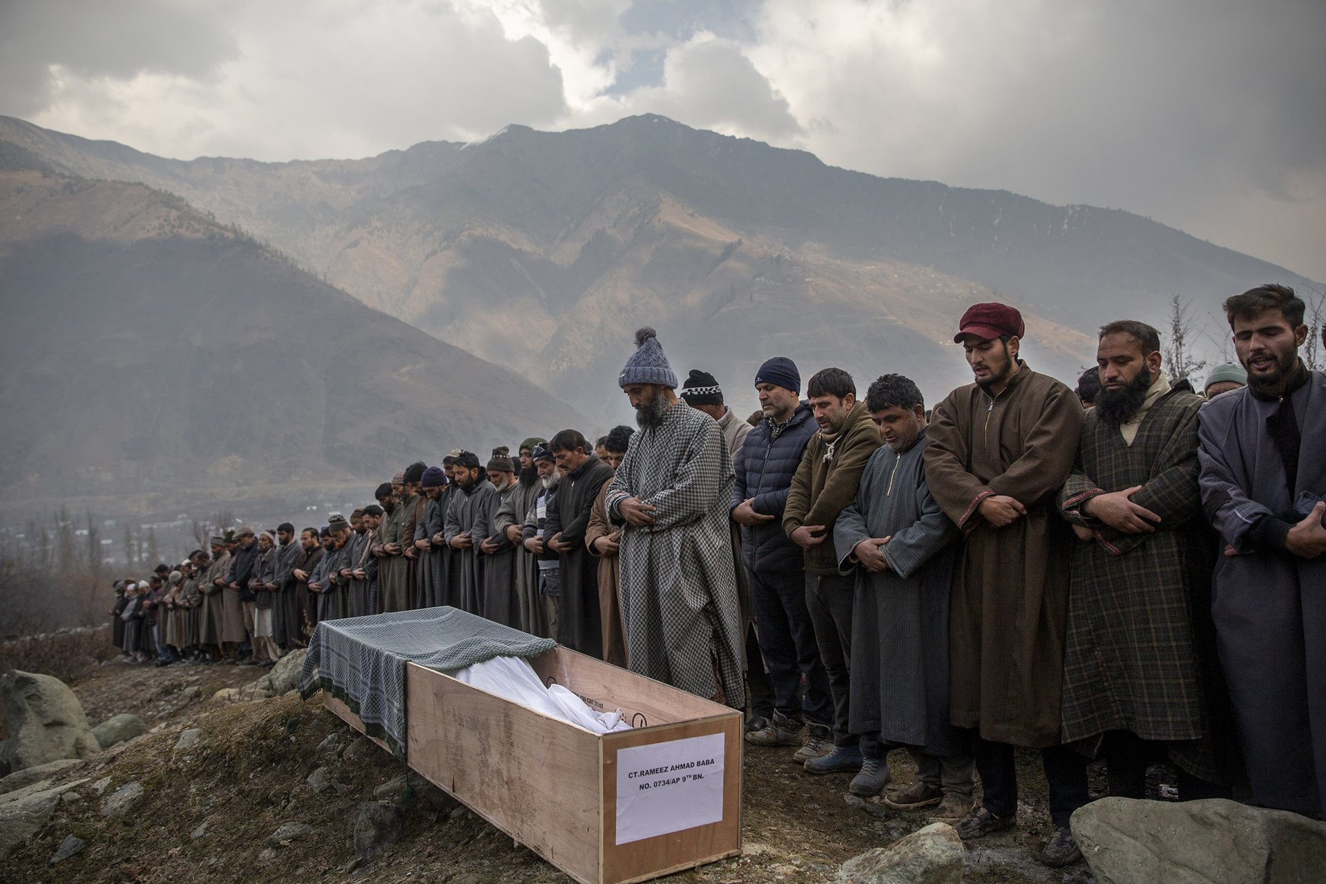 People offer funeral prayers for Constable Rameez Ahmad Baba, who according to Indian police succumbed to his injuries after he was on a bus that was attacked by militants in the Ganderbal district of Indian-administered Kashmir the previous day. At least 11 people were reported injured, and three killed in the attack.