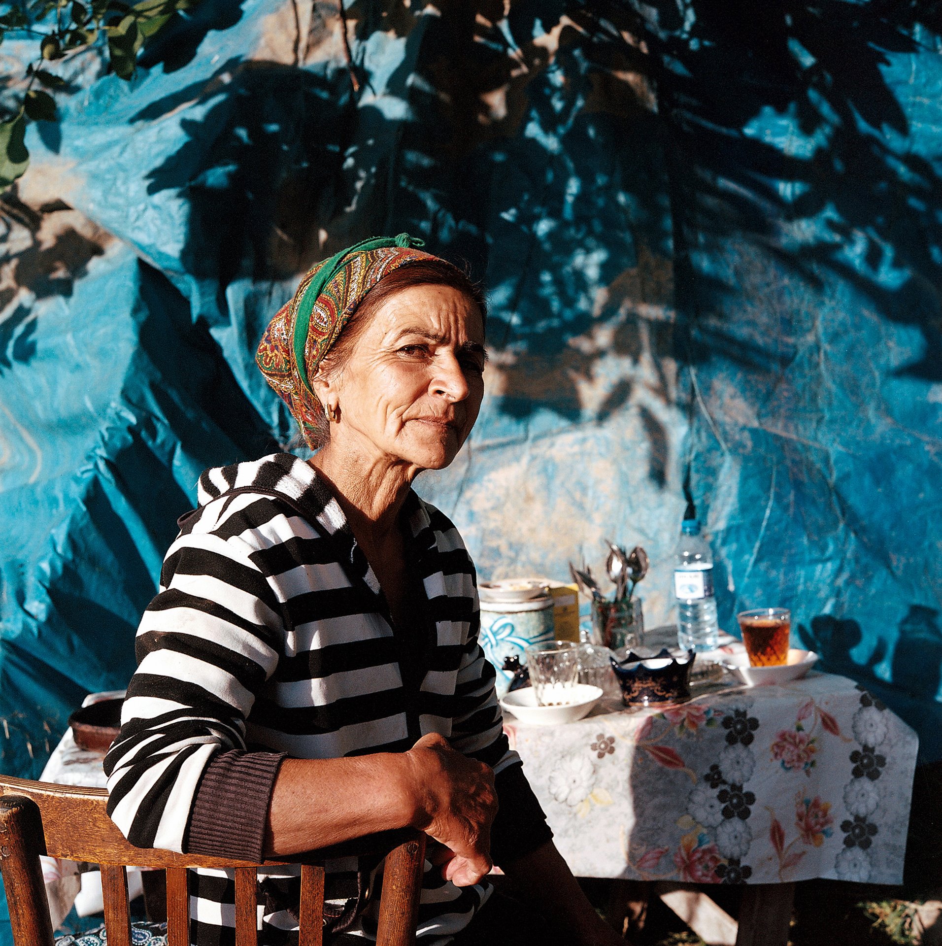 Fatima prepares tea for breakfast in Nakhchivan, Azerbaijan. Her family welcomed the photographer into their home for three consecutive years as she searched the region for <em>Satyrus effendi</em>, the rare native butterfly named after her father, Soviet entomologist Rustam Effendi.