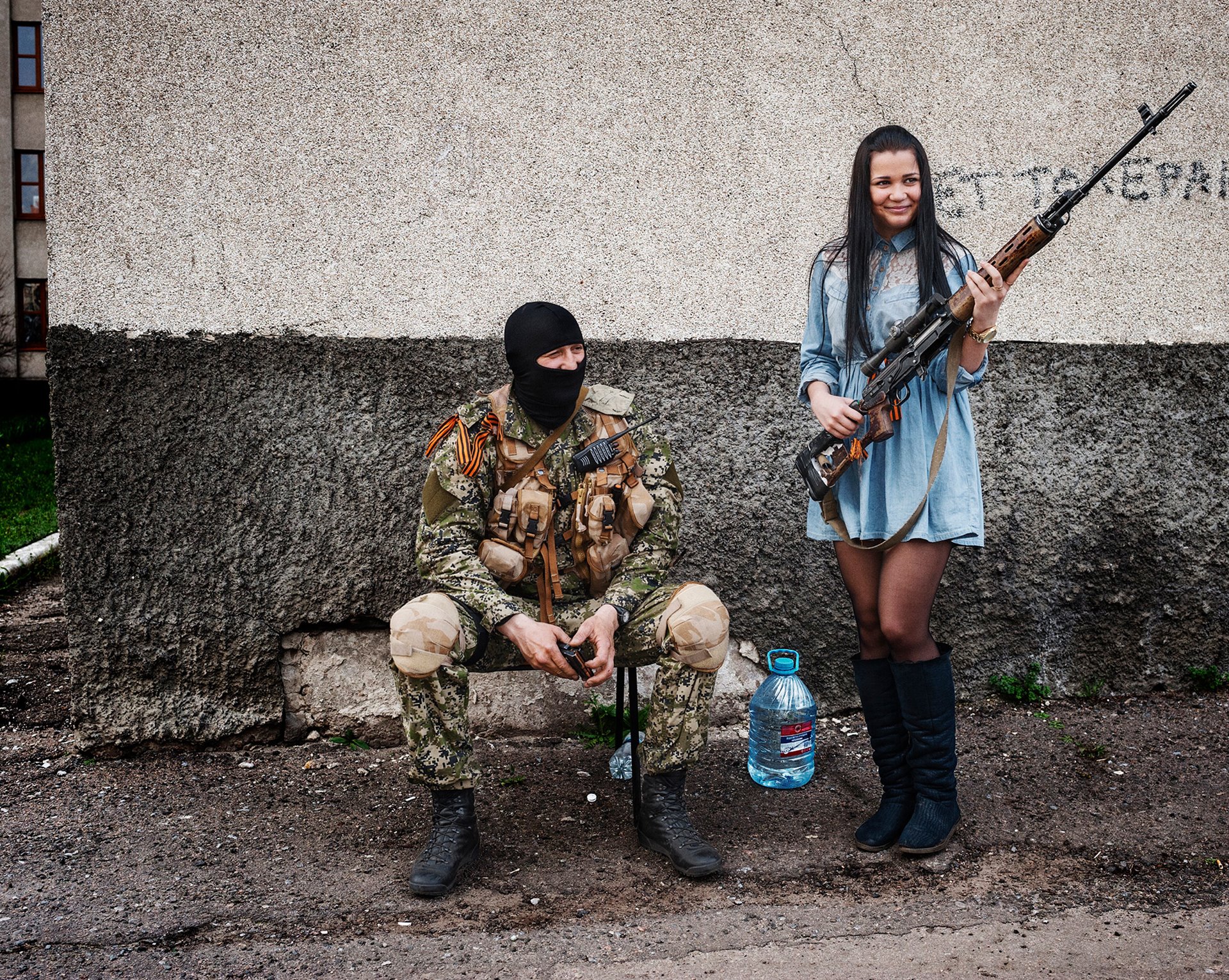 A young woman from Slovyansk, in northeastern Ukraine, poses with a gun while welcoming separatist fighters to the city. &nbsp;Separatist forces had occupied the city hall. Mayor Nellie Shtepa stated her support for the militants, while 150 of their supporters gathered at the local police station.