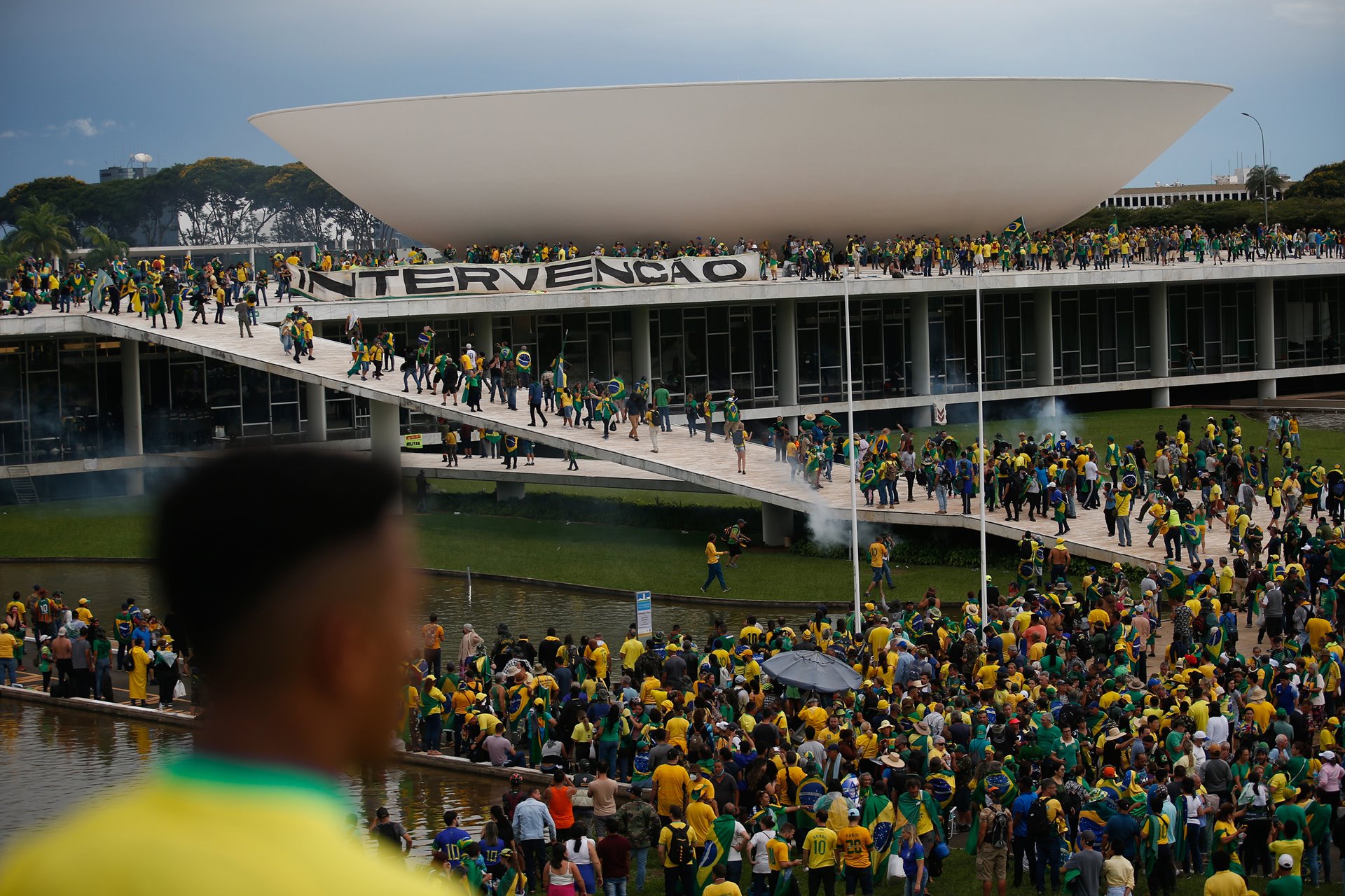 Right-wing protestors display a sign reading &ldquo;intervention&rdquo;at the Natioanl Congress Building, in Brasilia, Brazil.